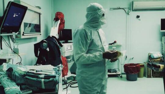 doctor in protective clothing in operating room